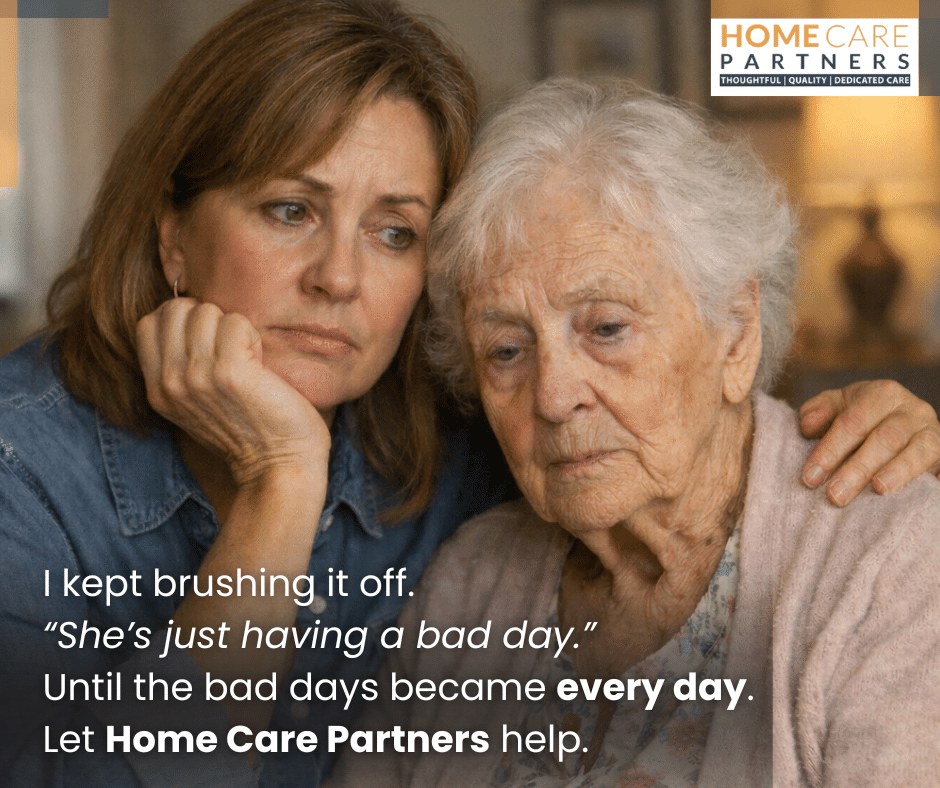 Caregiver and elderly woman sit closely together; caption promotes Home Care Partners home care services.